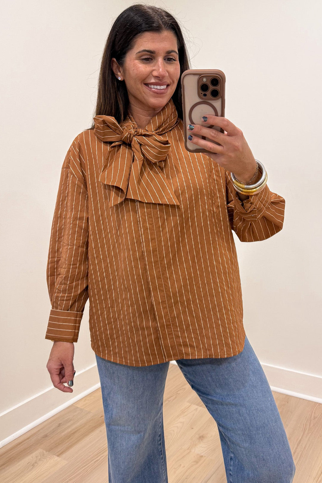 caramel and taupe striped mock neck long sleeve flap covered button front top