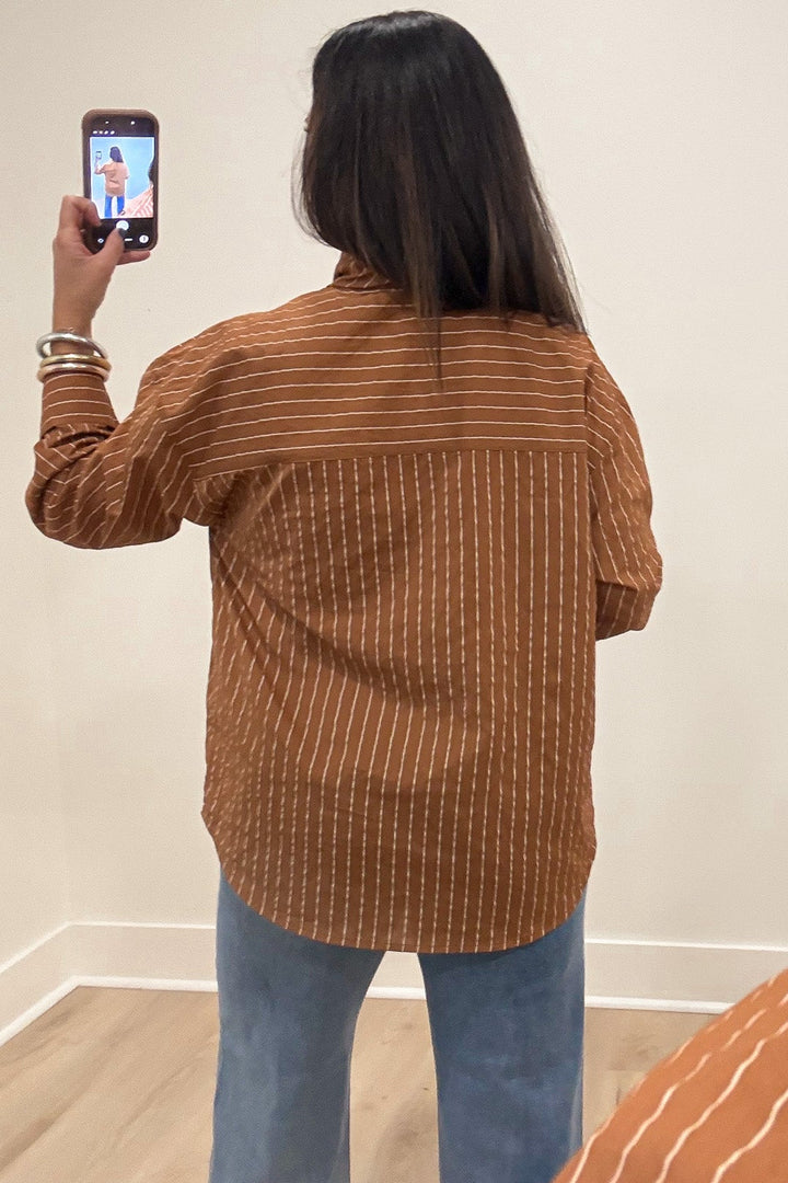 caramel with taupe stripes mock neck long sleeve flap covered button front top