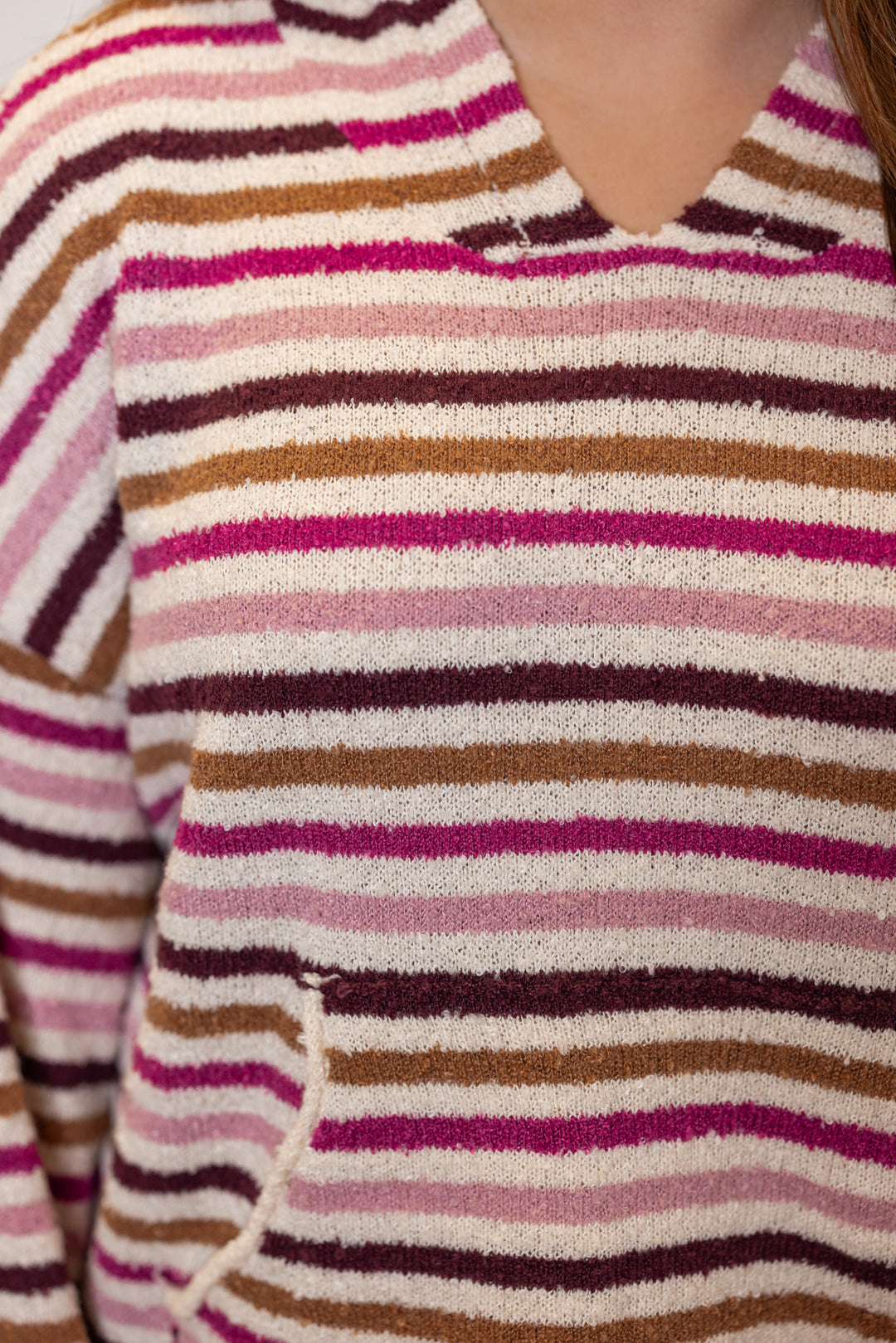Women's pink and cream multicolor hooded sweater by Peach Love California showing up close view of loop knit fabric