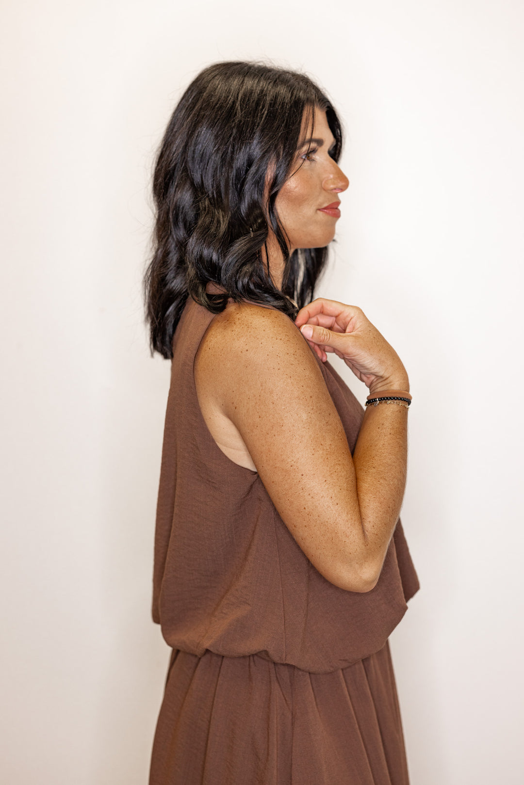 Espresso brown textured bubble hem sleeveless crop top by Entro showing up close side view