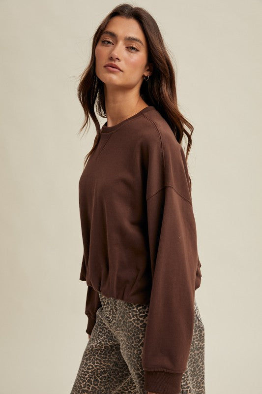 Women's chocolate brown terry knit long sleeve pullover top with bubble hem by Wishlist showing side view
