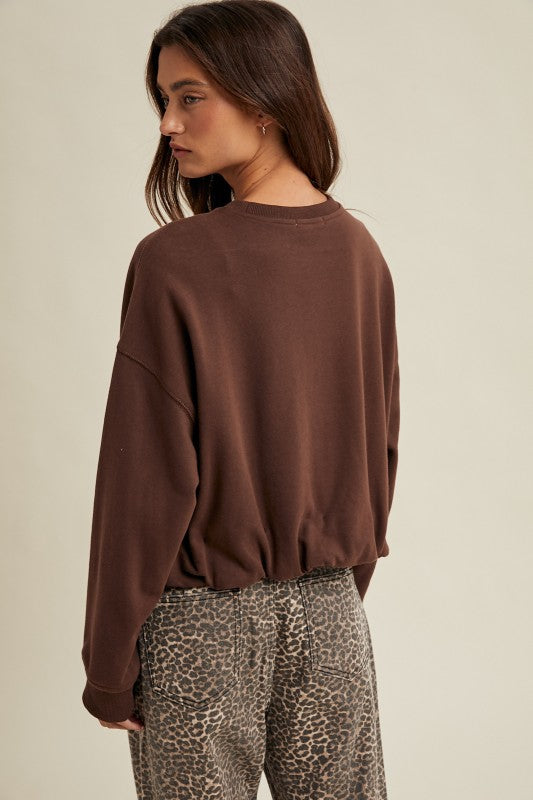 Women's chocolate brown terry knit long sleeve pullover top with bubble hem by Wishlist showing back view