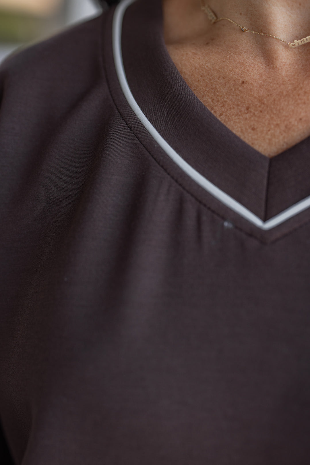 Women's chocolate brown scuba knit top by Rae Mode showing neckline details