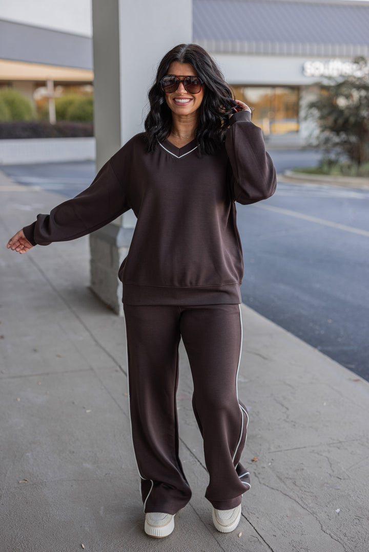 Women's chocolate brown scuba knit straight leg elastic waist pants by Rae Mode showing full front view