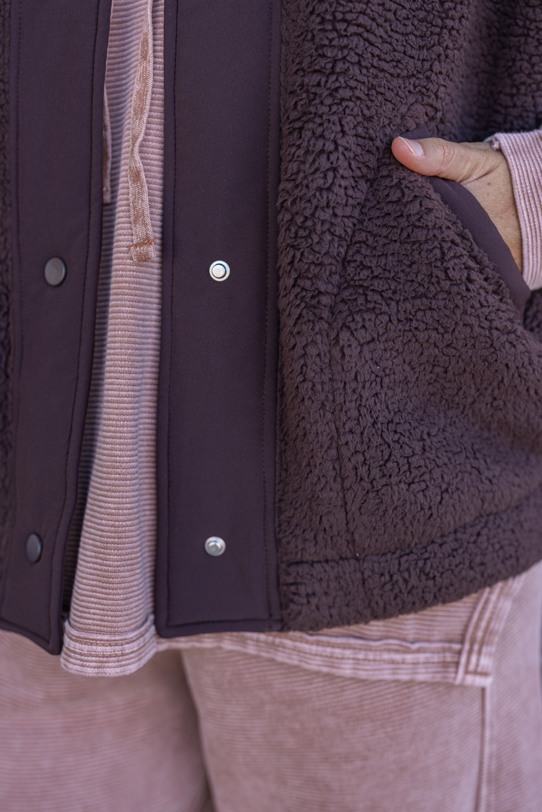 Women's espresso brown sherpa vest by Rae Mode showing pockets