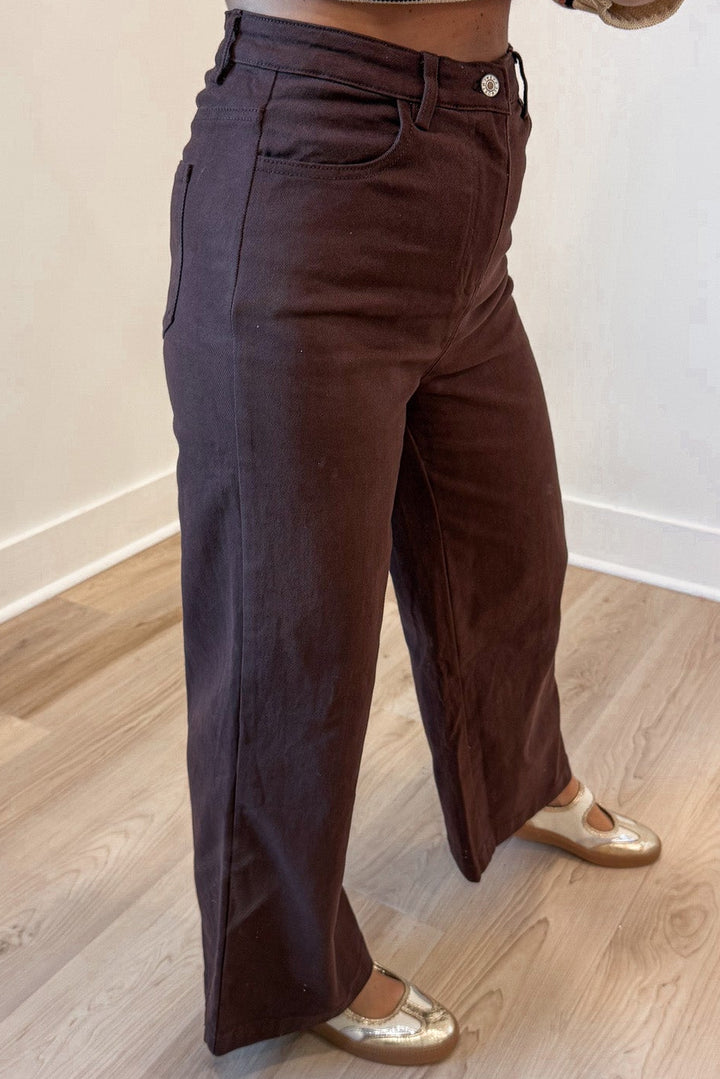 solid chocolate brown wide leg silhouette high waisted denim jeans with front pockets