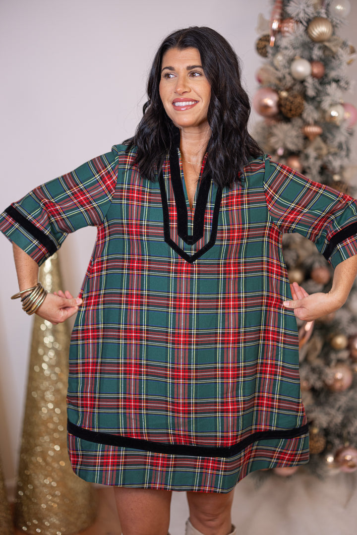Women's green and red plaid dress with black velvet trim by Entro showing true to size fit