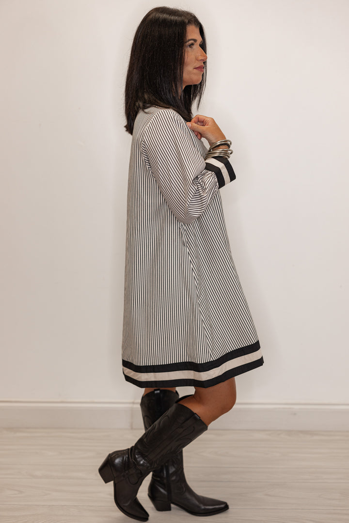 side view of Women's striped white and black shirt dress 
