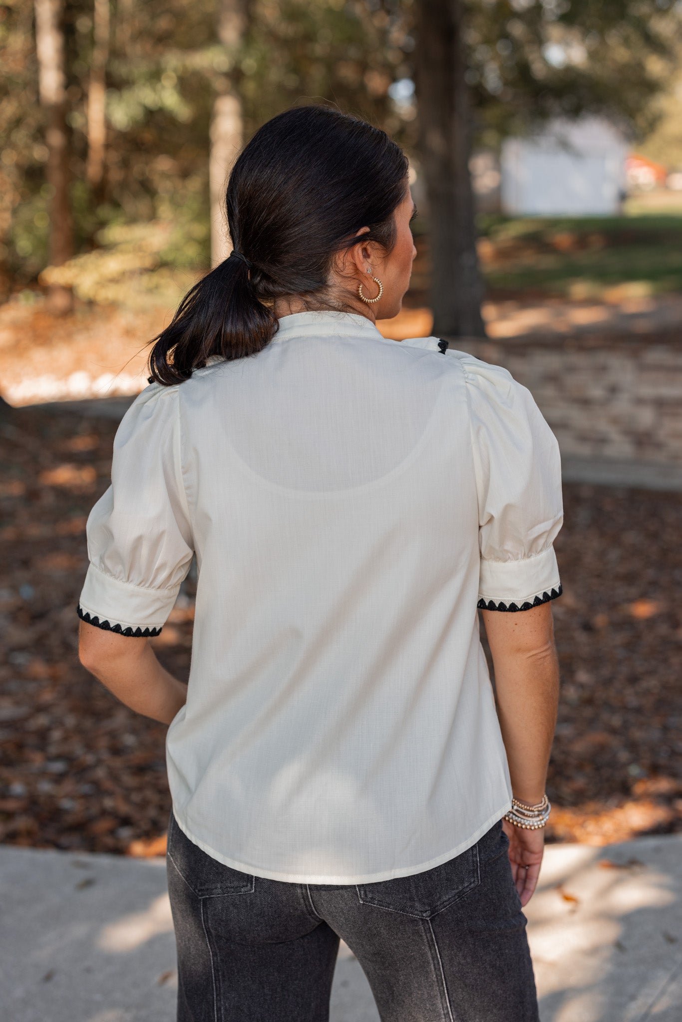 Cream And Black Embroidered Ruffled Top | Purple Door | Commerce