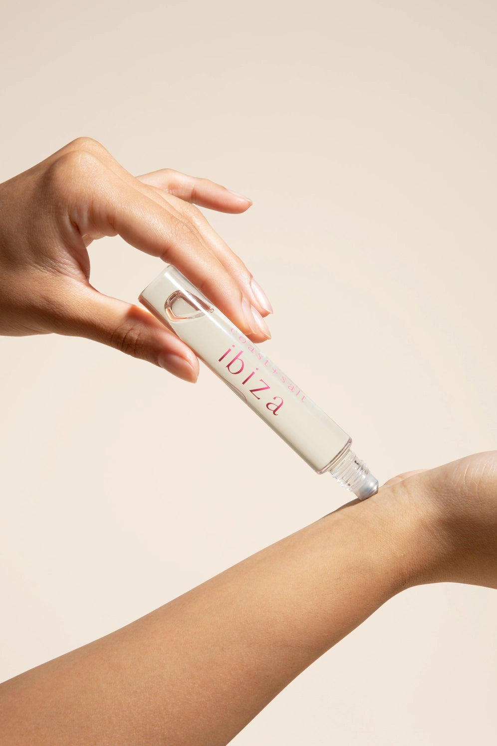 application of Coast + Salt Ibiza Perfume roll on bottle 