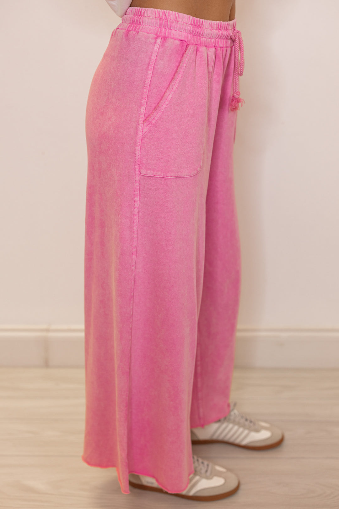Women's mineral washed barbie pink french terry knit wide leg cropped pants showing up close side view