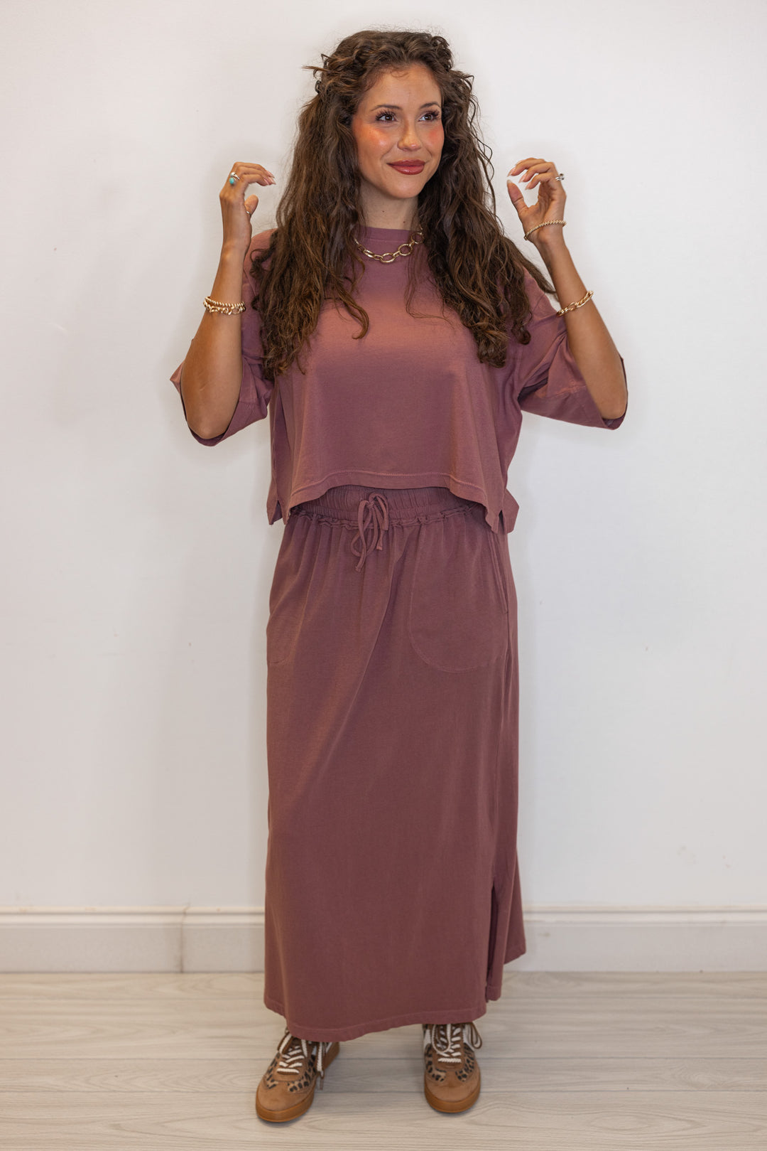 Women's dusty rose knit maxi skirt with matching crop top with chain necklace