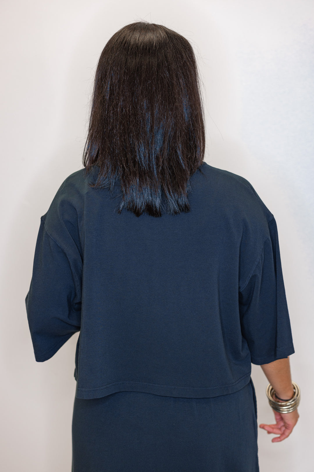 back view of Women's navy knit short sleeve top