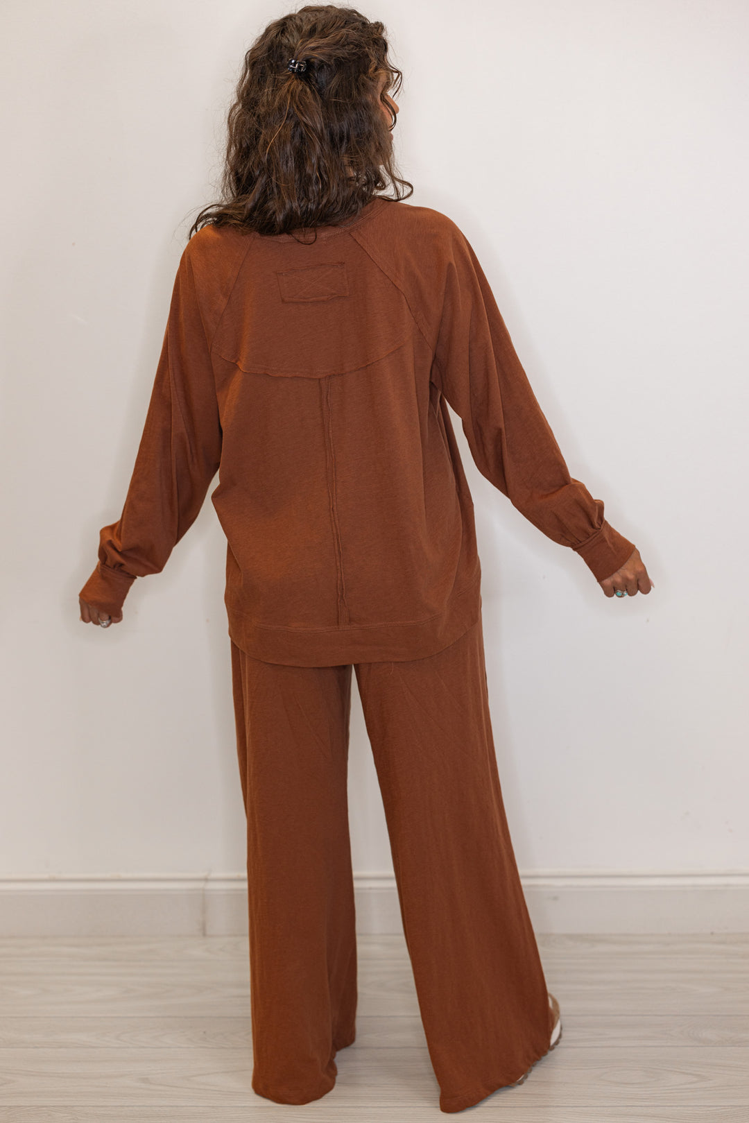 Back view of Women's chestnut brown athleisure long sleeve tee and pants cotton set