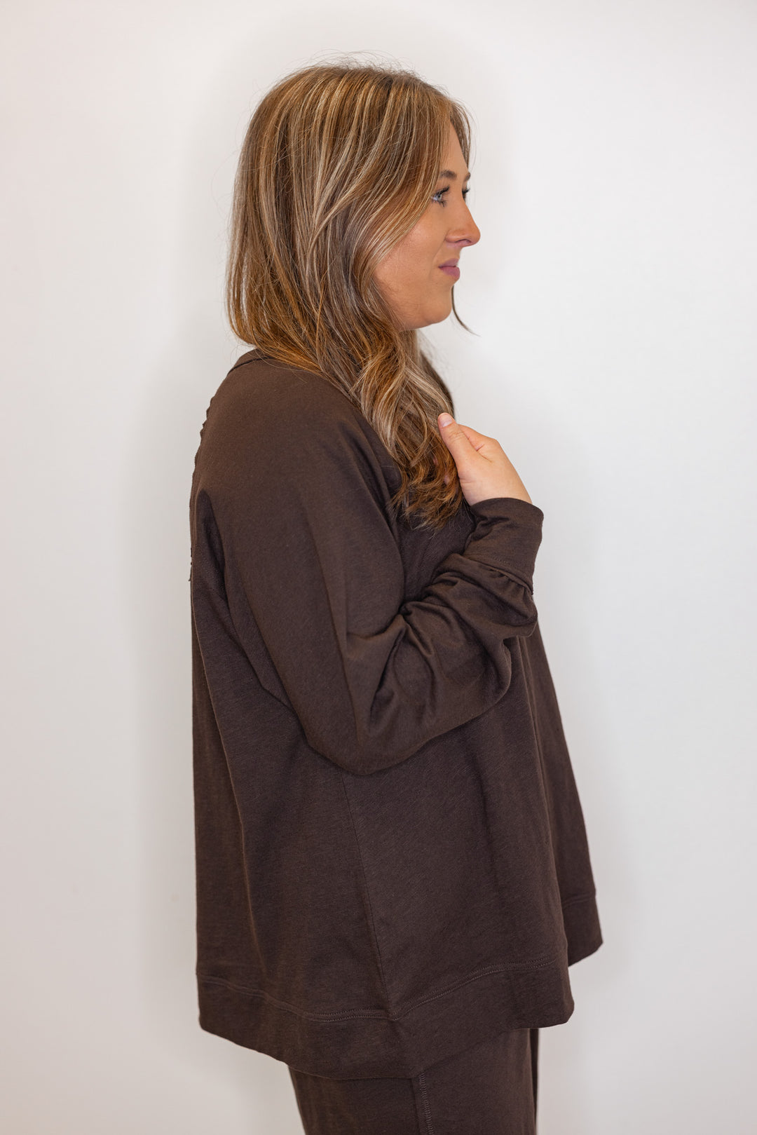 side view of women's brown long sleeve tee