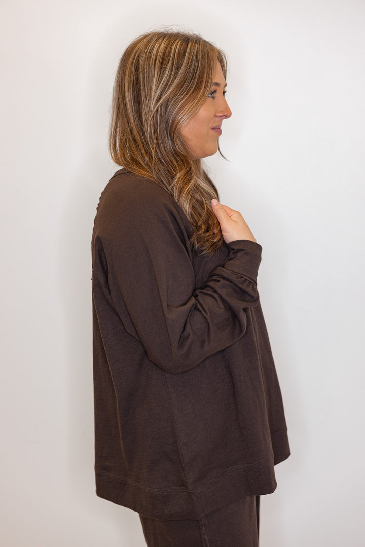 side view of women's brown long sleeve tee
