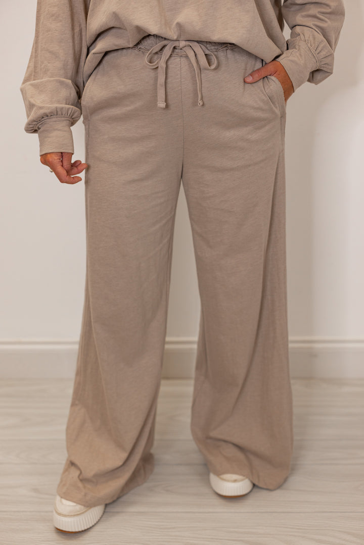 Women's beige athleisure pant with drawstring waistband