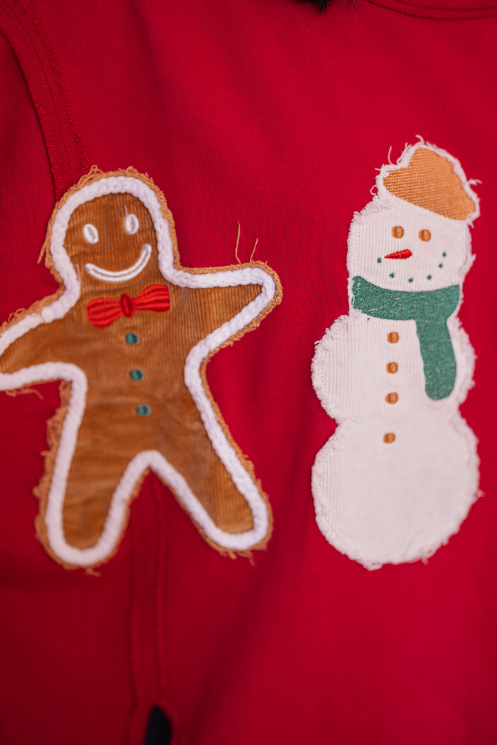 Women's crimson red sweatshirt with corduroy Christmas theme patches by Fantastic Fawn showing close look at gingerbread and snowman detail