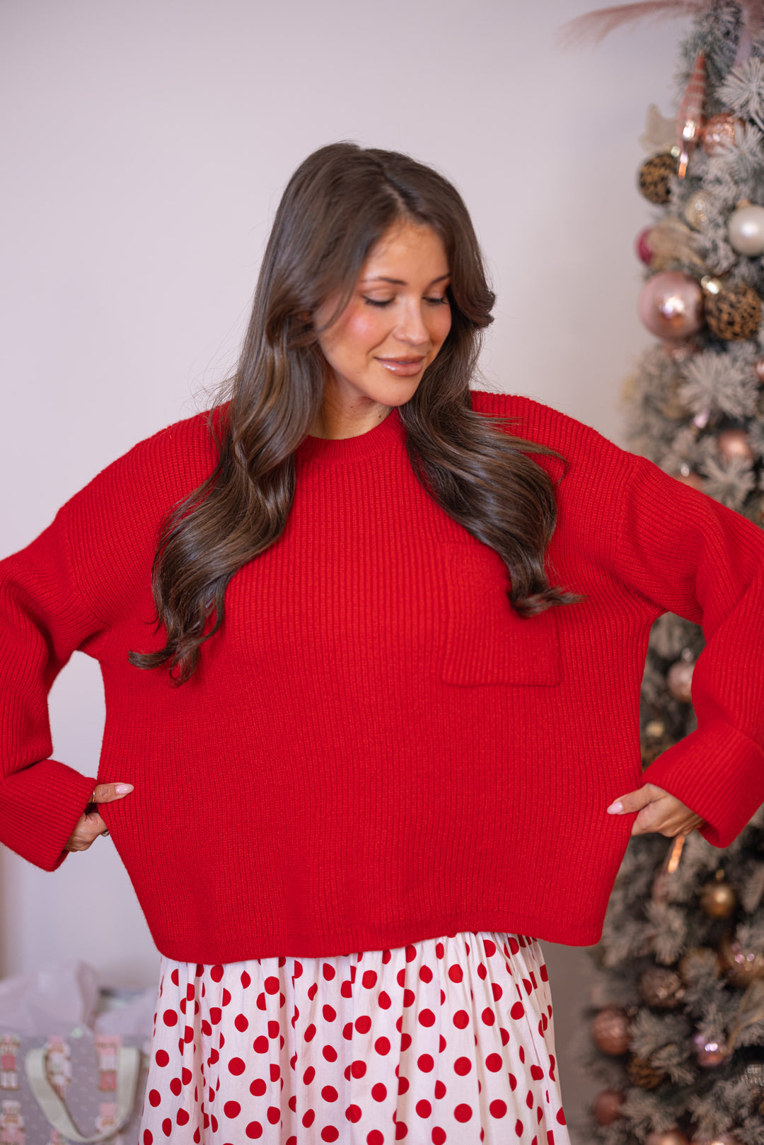 Women's red ribbed knit sweater with oversized long sleeves by Wishlist showing loose relaxed fit