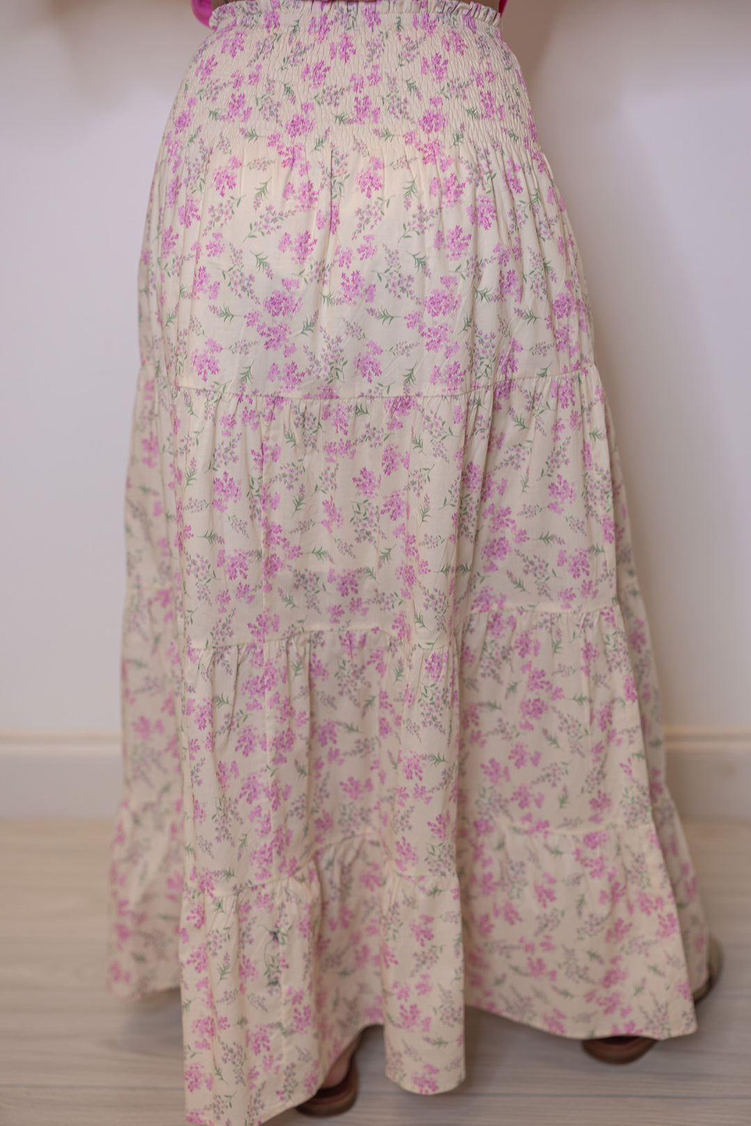 Women's cream tiered maxi skirt with pink floral print and a smocked waist by Wishlist showing up close back view