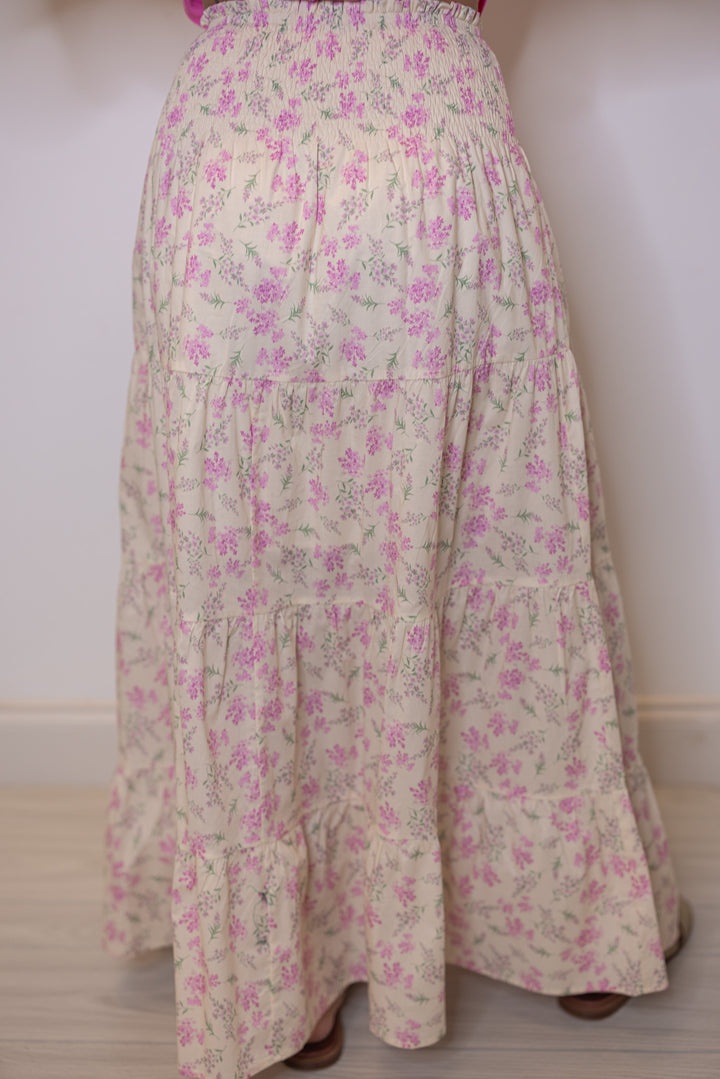 Women's cream tiered maxi skirt with pink floral print and a smocked waist by Wishlist showing up close back view