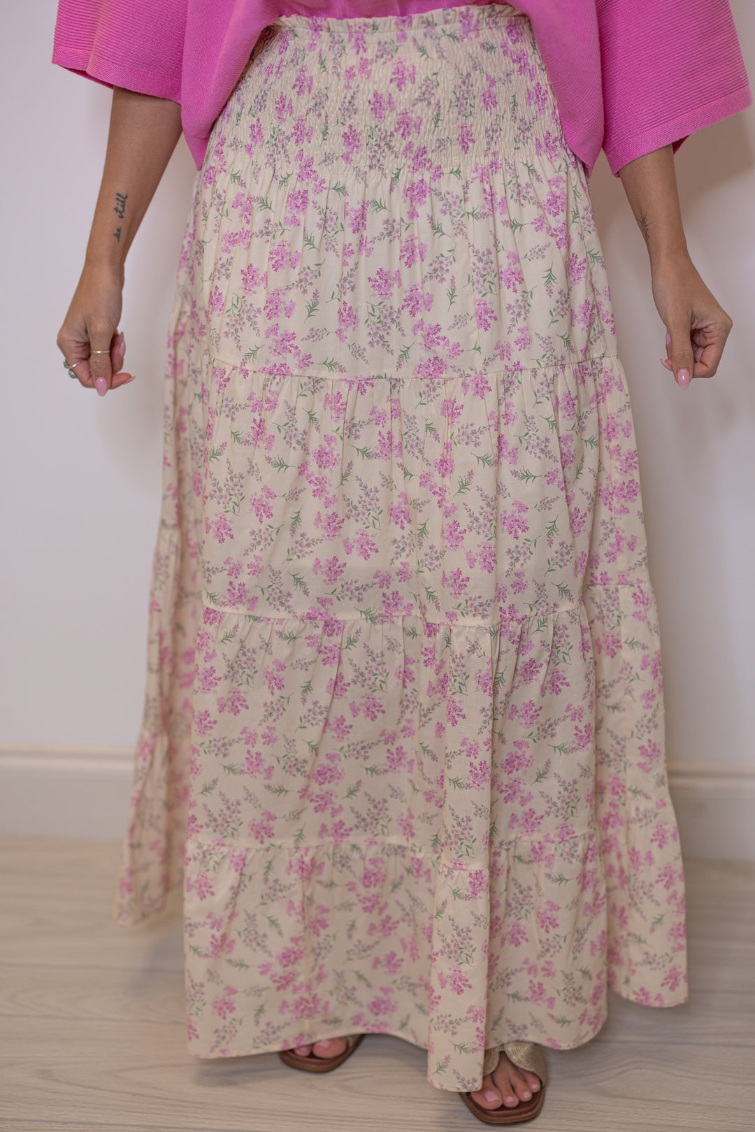 Women's cream tiered maxi skirt with pink floral print and a smocked waist by Wishlist