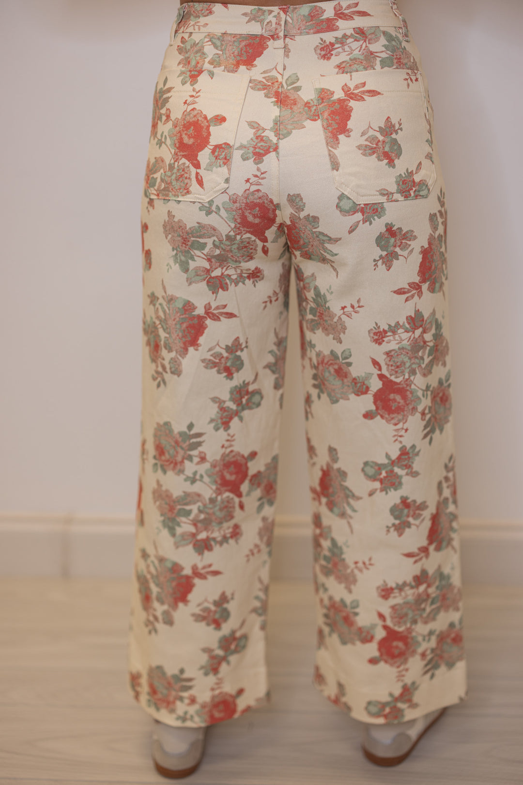 Women's cream twill floral print wide leg pants by Entro showing back pockets