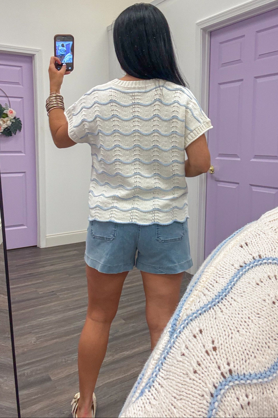 light blue wave striped crew neckline cream knit top