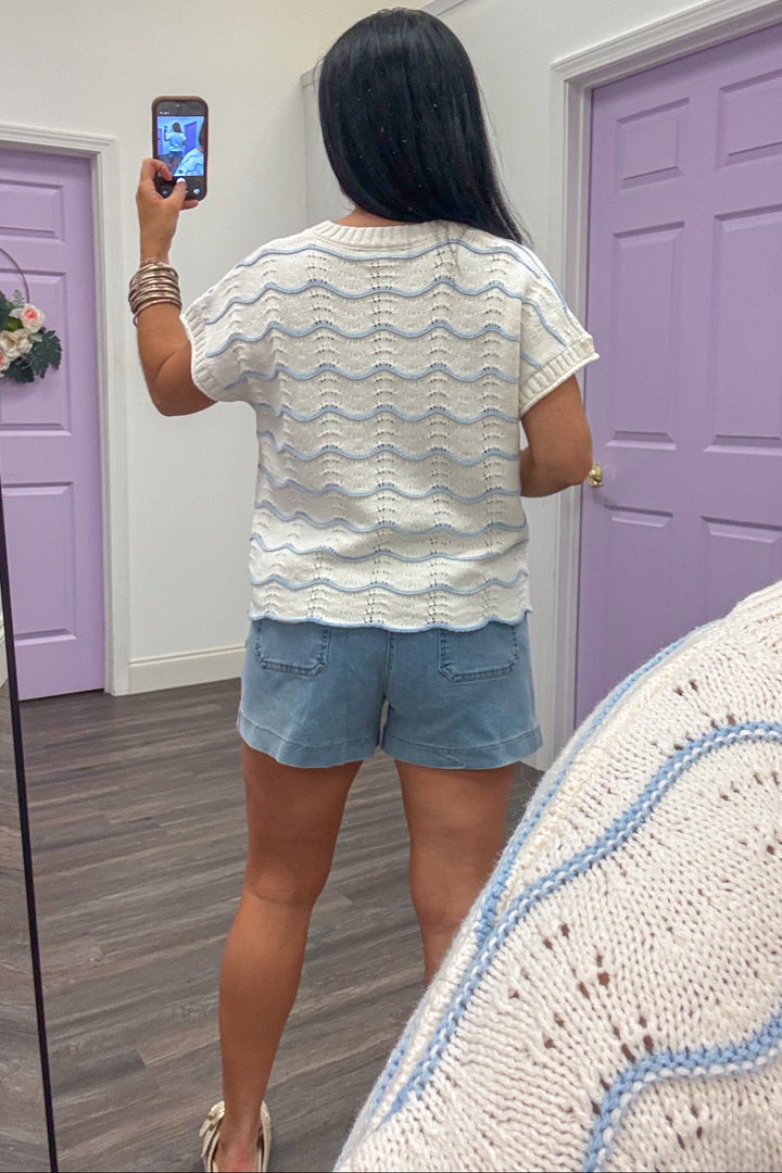 light blue wave striped crew neckline cream knit top