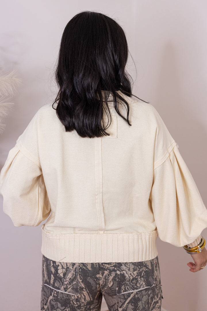 Women's ecru terry knit button front cardigan with textured ribbed knit trim by Entro showing up close back view