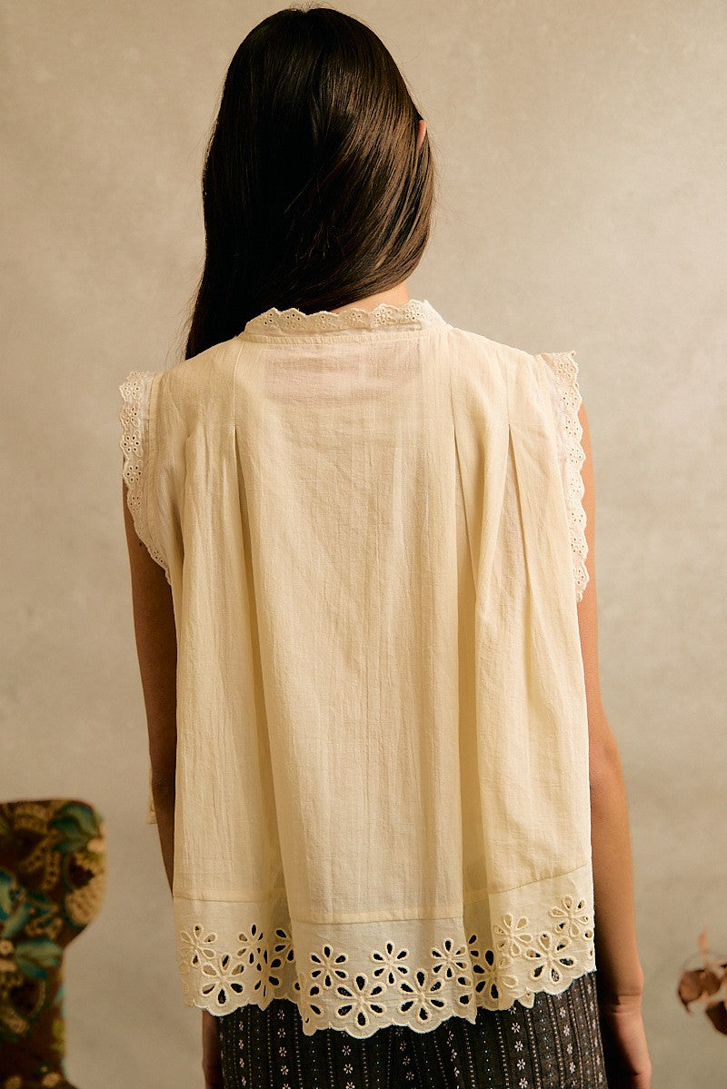 Cream button front top with embroidery floral lace details in a flattering silhouette