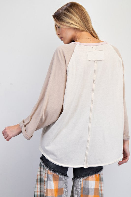 Women's cream and khaki colorblock jersey knit top showing back view
