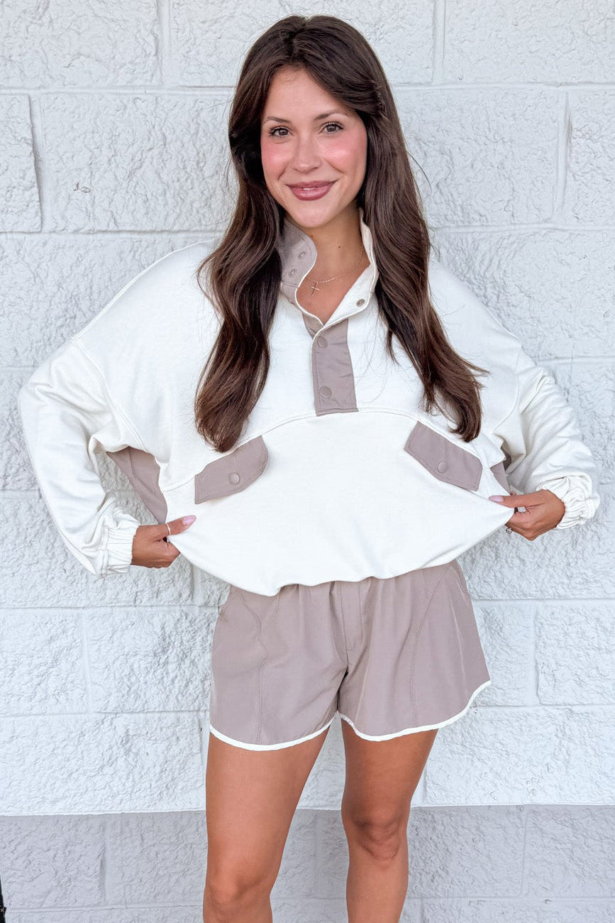 cream with mocha colorblock details snap bodice long sleeve pullover with banded bottom hem