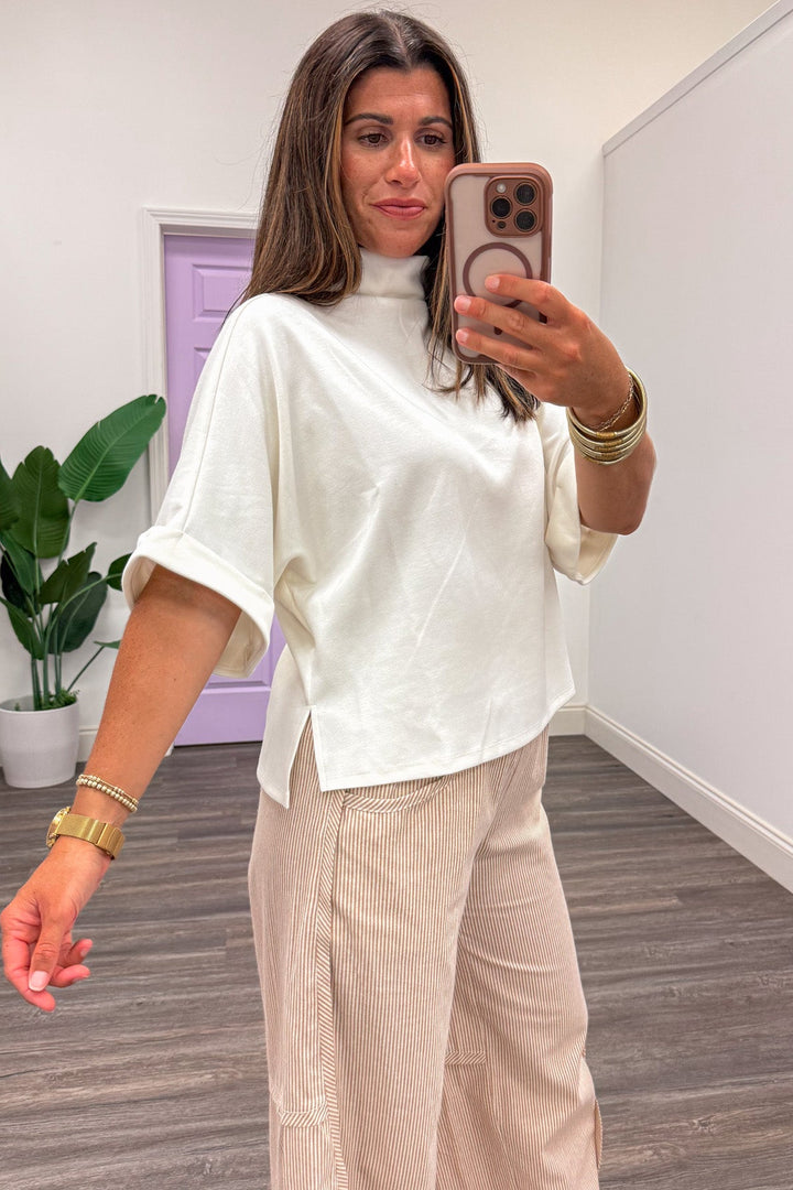 solid cream mock neckline short dolman sleeve soft luxe knit top with side slits at hem