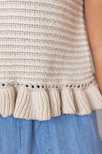 beige sleeveless knit top