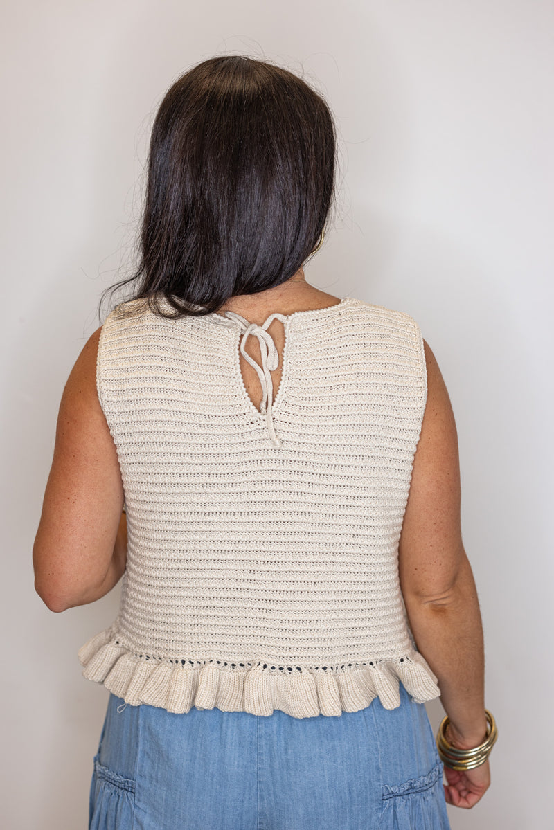 beige sleeveless knit top