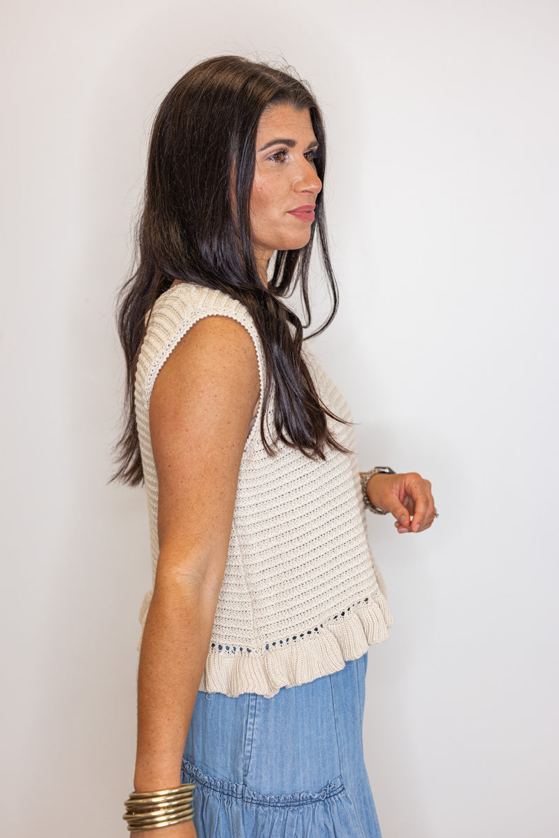 beige sleeveless knit top