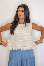 beige sleeveless knit top