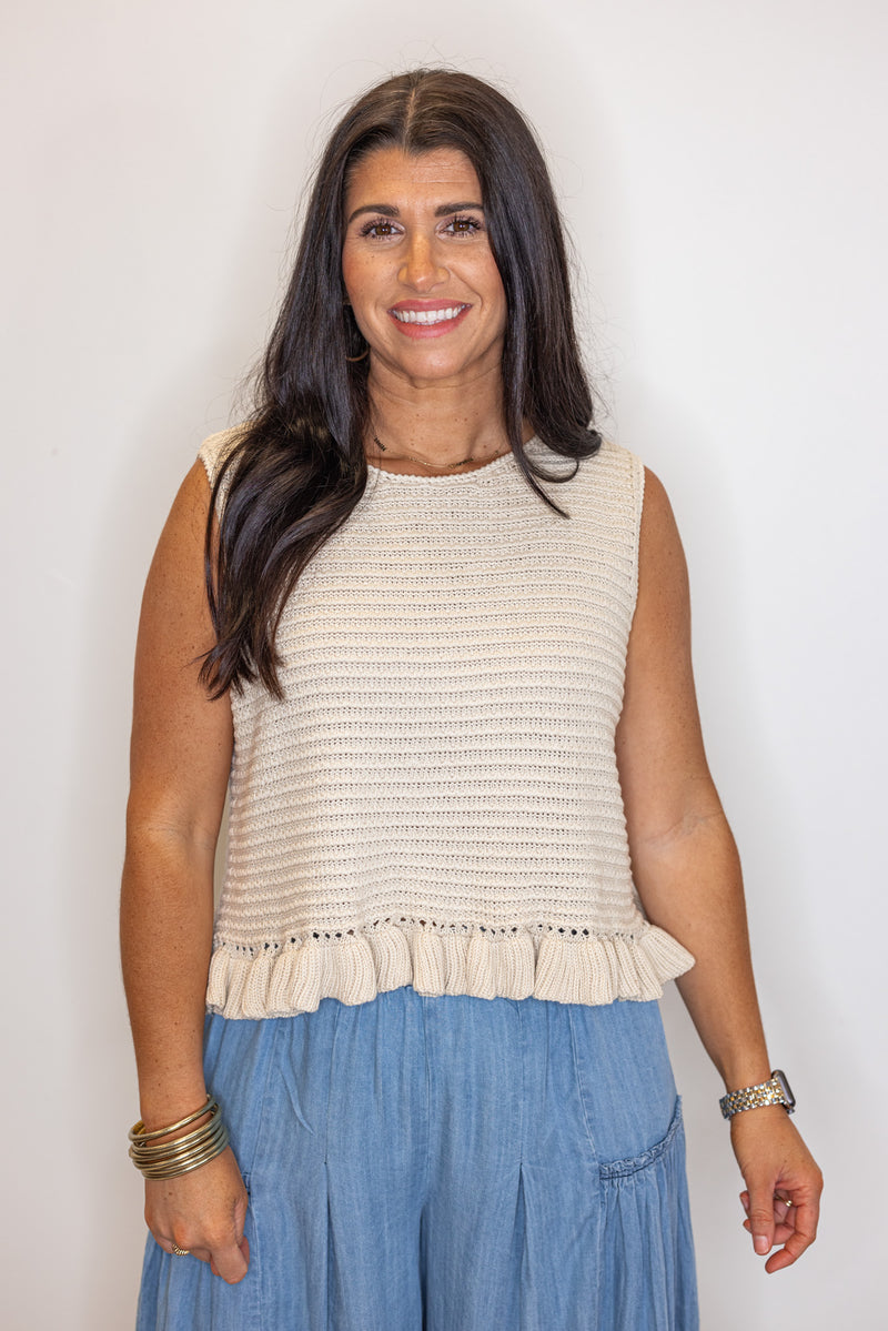 beige sleeveless knit top