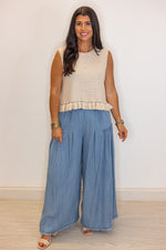beige sleeveless knit top