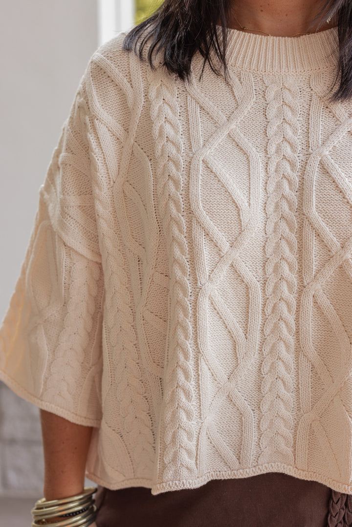 Women's ecru cable knit cropped sweater by Entro showing up close front view