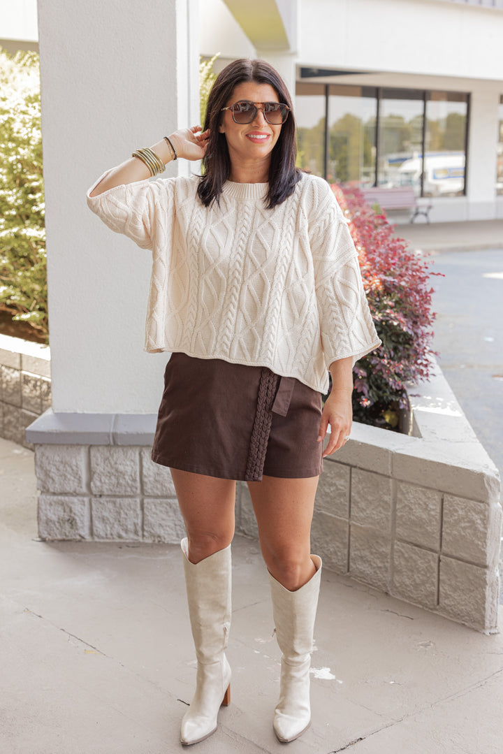 Women's trendy ecru cable knit cropped sweater by Entro, perfect for fall