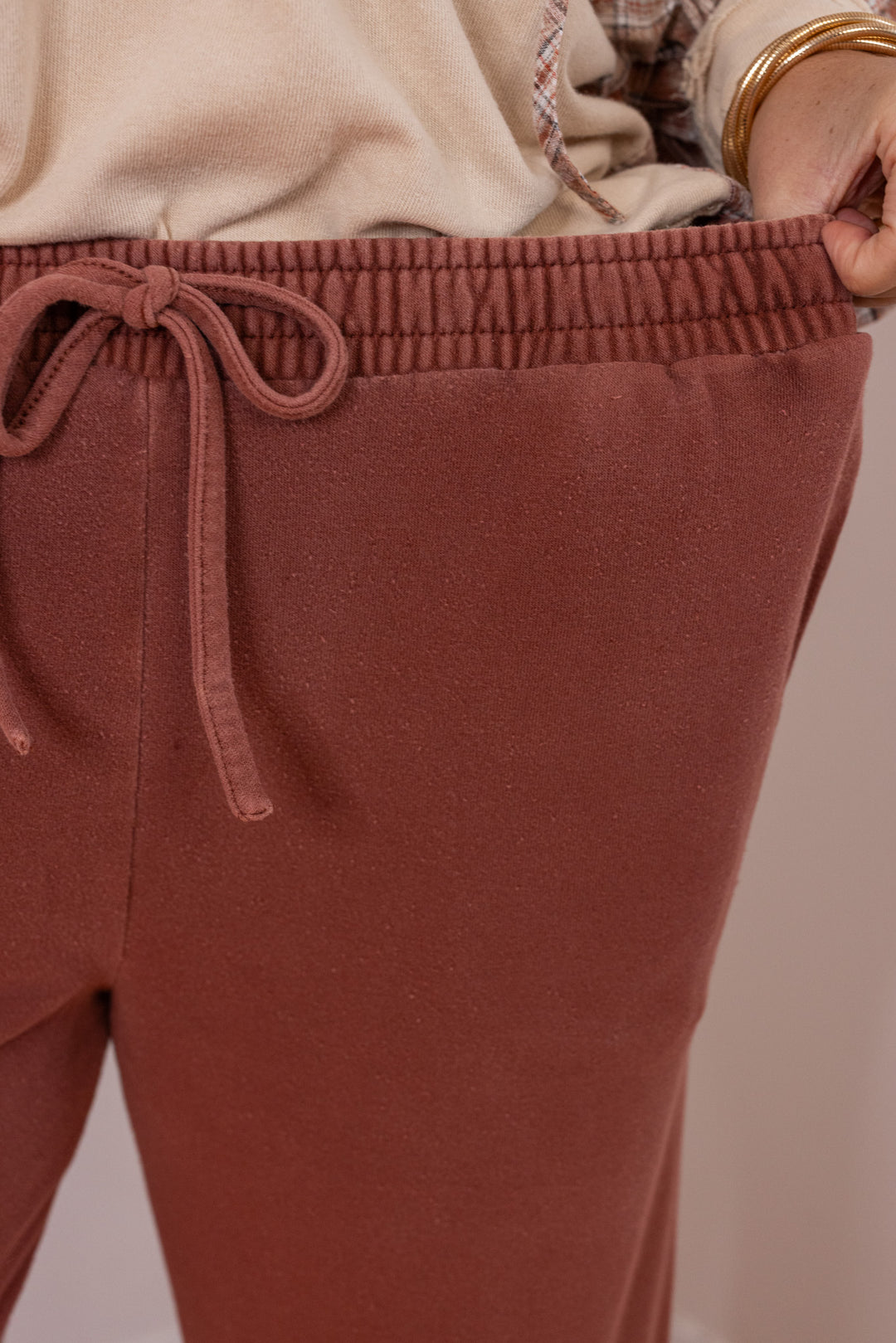 Women's washed terra-cotta terry knit wide leg jogger pants by Blu Pepper showing elastic waistband