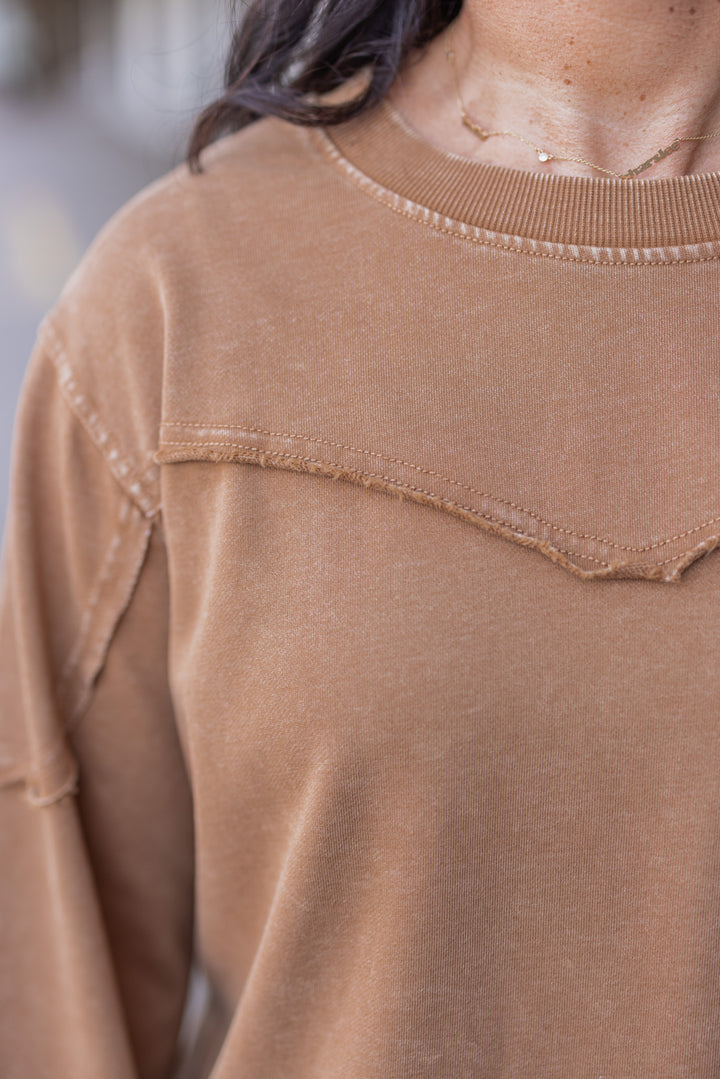 Women's mineral washed caramel terry knit pullover by Easel showing raw/reverse seam details