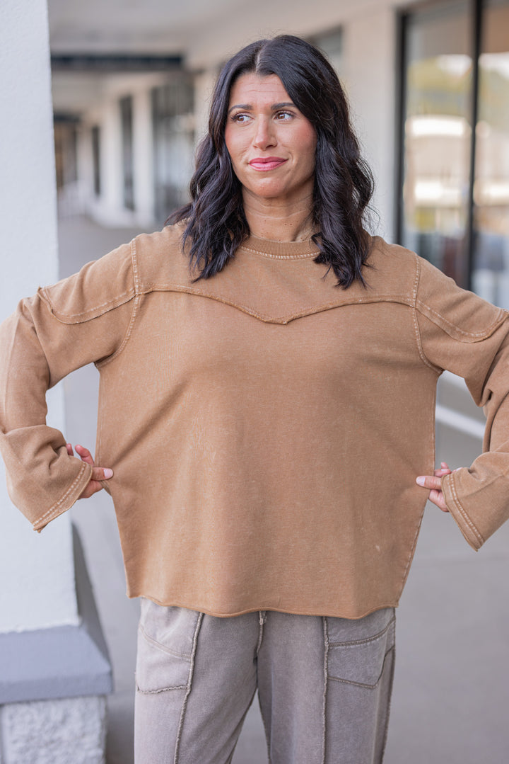 Women's mineral washed caramel terry knit pullover with raw/reverse seam details by Easel showing relaxed silouhette