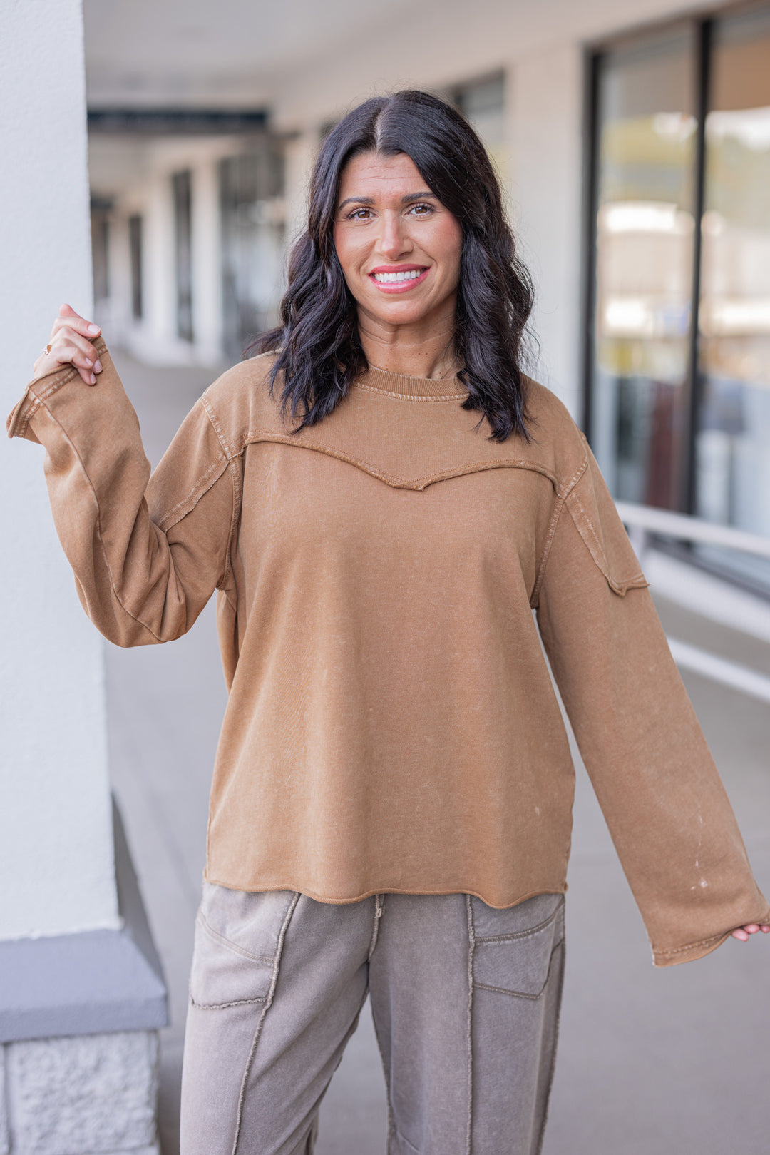 Women's mineral washed caramel terry knit pullover with raw/reverse seam details by Easel showing up close front view