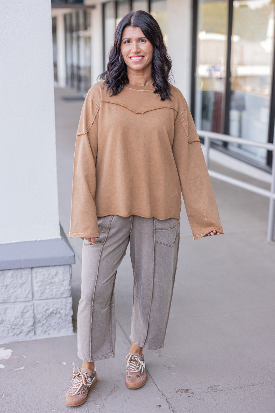 Women's mineral washed caramel terry knit pullover with raw/reverse seam details by Easel showing full front view
