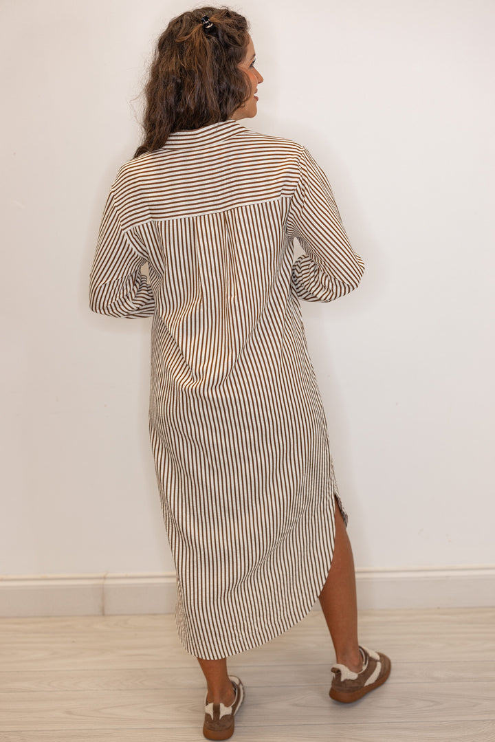 back view of Women's long sleeve caramel and ivory  striped maxi dress