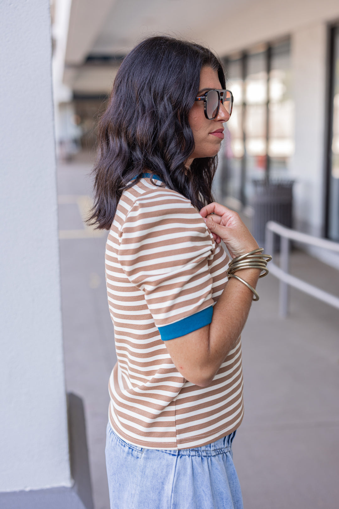 Women's tan striped knit textured top with dark turquoise trim by Entro showing up close side view