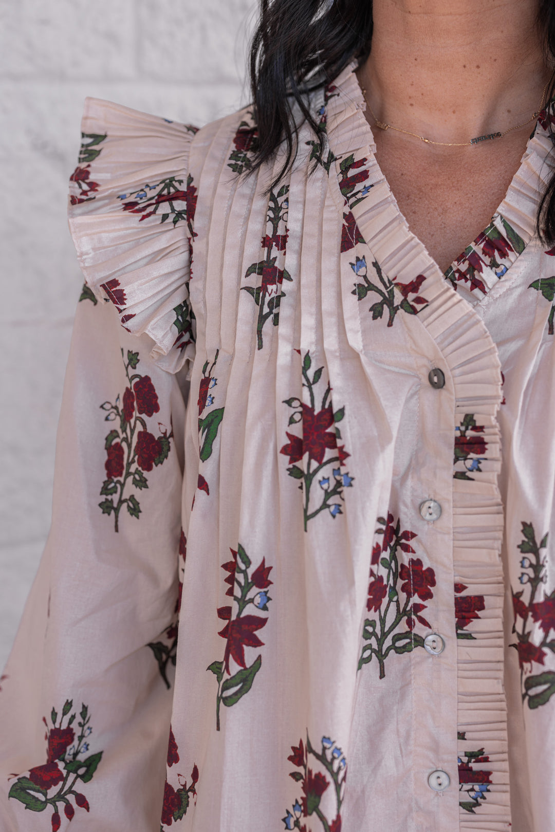 Women's ecru and burgundy floral print babydoll top by Entro showing pleats and ruffle details